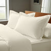 Ivory oxford standard pillowcases deluxe 600 thread count on pillows on bed in bedroom